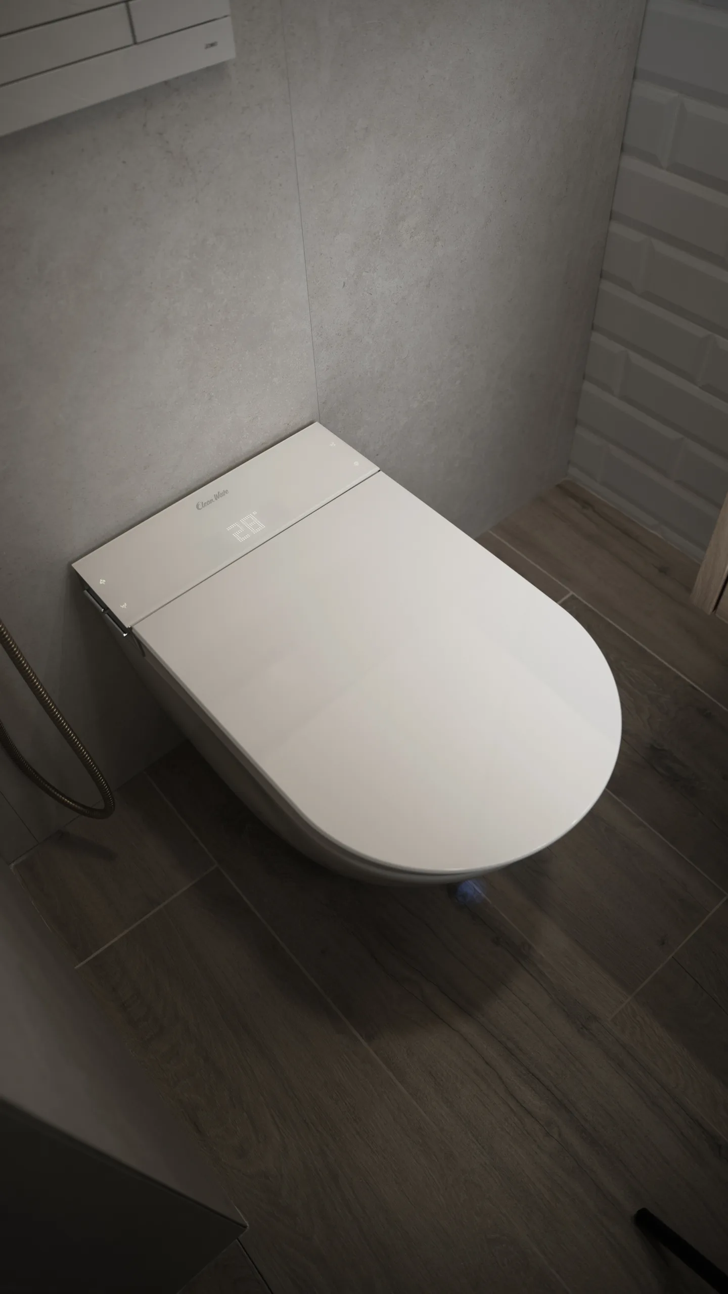 Breeze with closed lid in a grey tiled bathroom